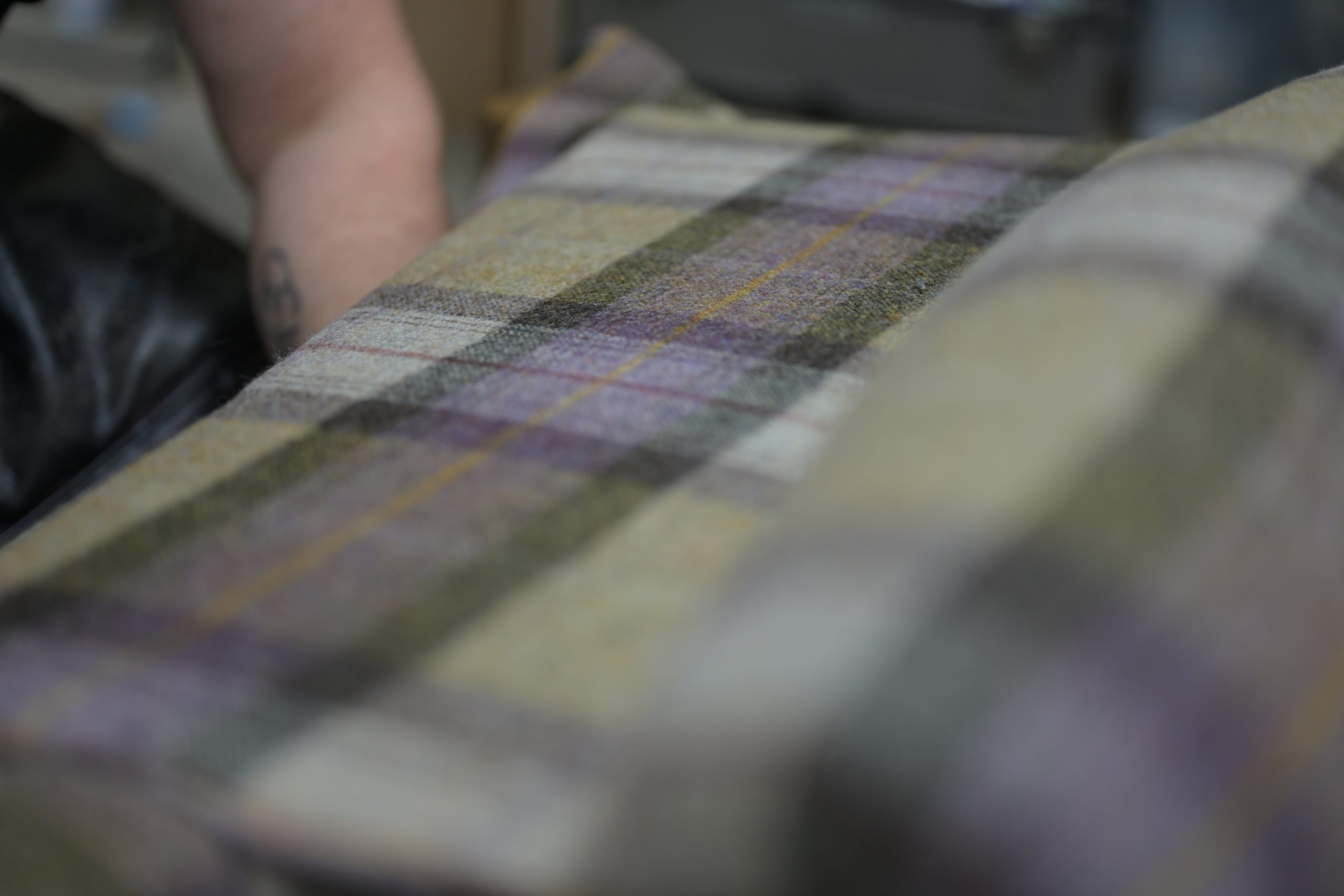 Close-up of checked upholstery fabric in the D&P workshop