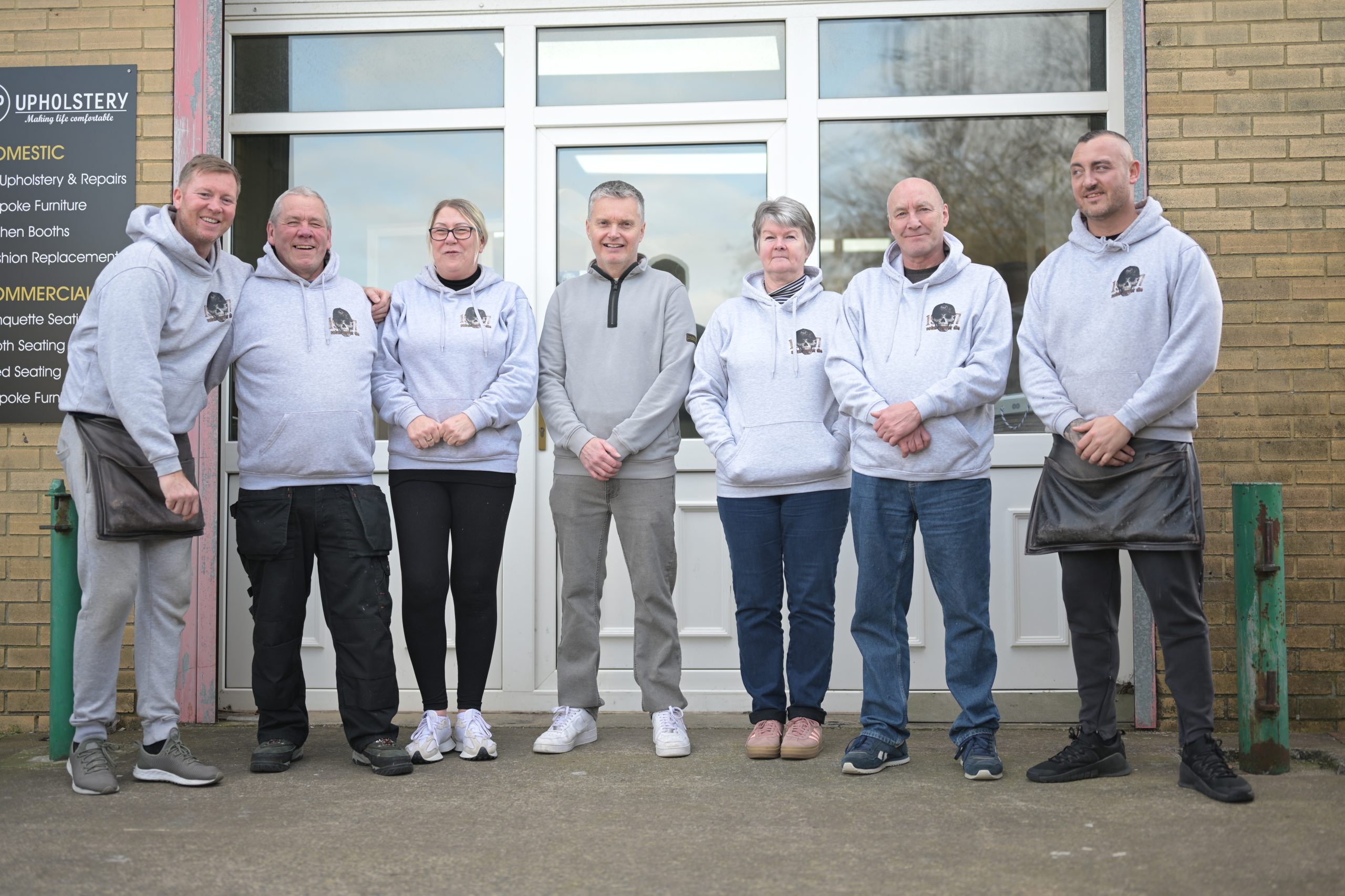 The seven members of the D&P Upholstery team outside the Gateshead workshop
